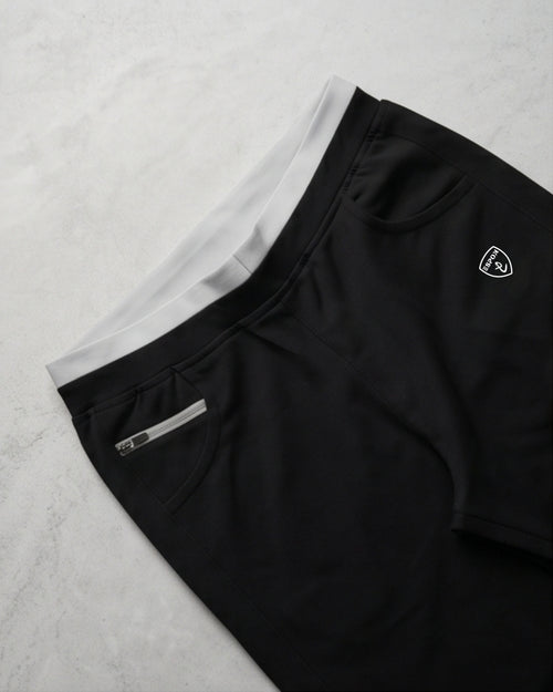Black ESPON track pants with 4-way lycra and pocket details.