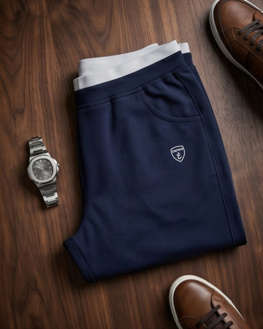 "Dark blue men's athletic track pants with white inner lining and pocket."