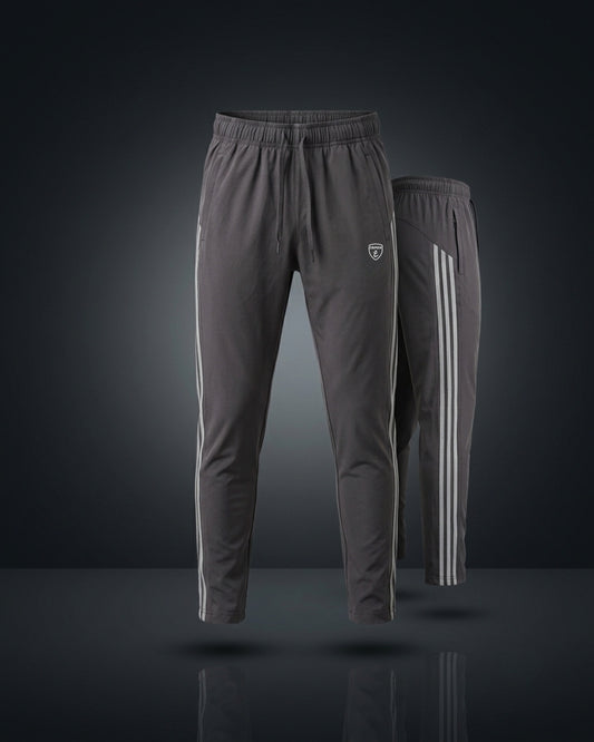 Gray track pants with white stripes, elastic waist, slim athletic fit.