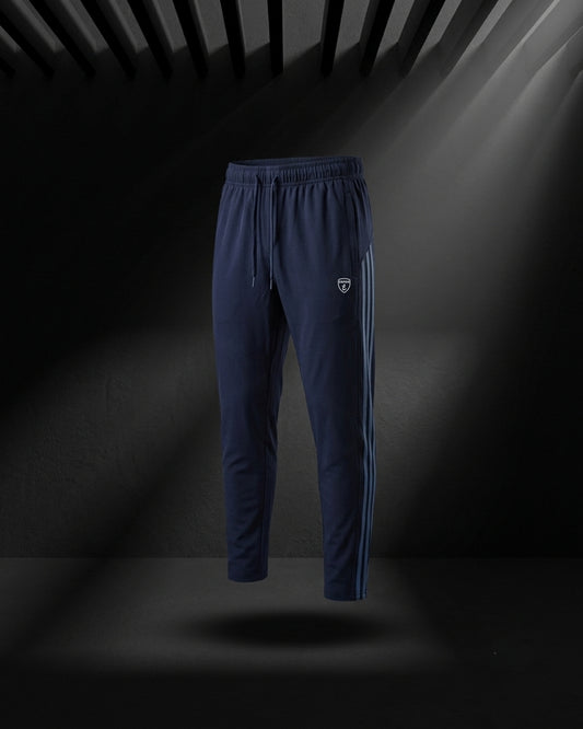 "Dark blue slim fit track pants with side stripe and elastic waist."