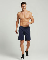 "Man wearing navy blue ESPON Air Flex 4-way active shorts."