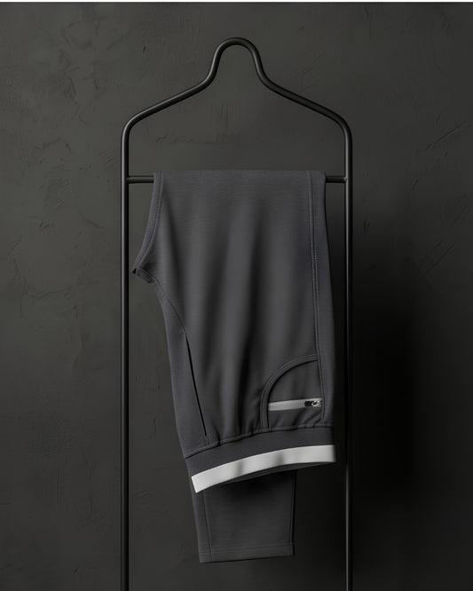"Black ESPON Air Flex track pants with 4-way lycra and pocket."